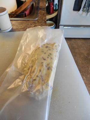 Shape dough in wax paper